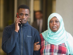 Mohamed Sail walks out of a London court Monday afternoon a free man as his mother says, ?Justice has been made.? (MIKE HENSEN, The London Free Press)
