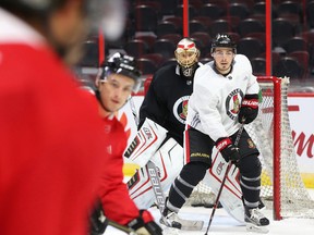 Jean-Gabriel Pageau, right, screens goalie Craig Anderson of the Ottawa Senators during morning skate at Canadian Tire Centre in Ottawa on Sept. 18, 2017. (Jean Levac/Postmedia)