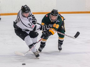 Forward Ryan Casselman, left, is seen in his first junior C season with the Napanee Raiders (2013-14), battling for the puck with Amherstview Jets forward Josh Leblanc, now of the Kingston Voyageurs. (Tim Gordanier/The Whig-Standard)