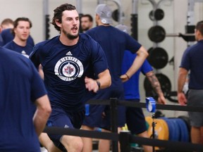 Connor Hellebuyck’s hard work at training camp paid off in last night’s pre-season opener. THE CANADIAN PRESS
