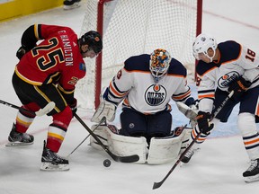 Edmonton Oilers Ryan Strome and Calgary Flames Freddie Hamilton battle for the puck in front of goalie Cam Talbot during preseason NHL action on Monday September 18, 2017 in Edmonton.