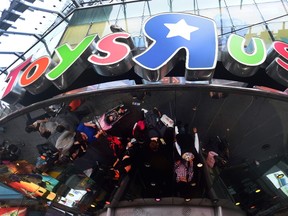This file photo taken on December 24, 2015 shows customers in front of the Toys R Us Times Square flagship store in New York.