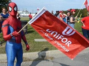 Todd Scott donned his Spider-man suit joining his fellow Cami employees picket at the Ingersoll Automotive Assembly Plant on Day One of a strike by workers on Monday September 18, 2017 (MORRIS LAMONT, The London Free Press)