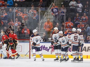 Edmonton Oilers players celebrate a goal against the Calgary Flames during first period NHL preseason split-squad hockey action in Edmonton, Alta., on  September 18, 2017.