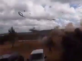 A video posted online on showed a Ka-52 helicopter firing a rocket that explodes next to a spectator on a parking lot at the Luzhsky range, about 100 kilometres (60 miles) east of the border with Estonia. (YouTube screengrab)