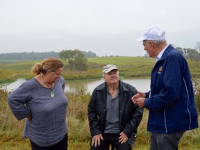 Mary Ellen King and John King and Brooke-Township Mayor Don McGugan take a moment to chat while overlooking a wetland habitat that has been thriving for five years. On Tuesday, the Alternative Land Use Service organization announced it will establish five pilot programs on 2,100 acres in Ontario, including sites in Lambton and Middlesex counties and Chatham-Kent. (Melissa Schilz/Postmedia Network)