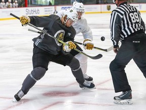 Vegas Golden Knights' William Karlsson, left, and Vadim Shipachyov faceoff in a scrimmage game during NHL hockey team practice at City National Arena, Friday, Sept. 15, 2017, in Las Vegas. (THE CANADIAN PRESS)