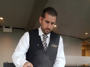 Server Colin Murphy has mastered the art of table-side cooking