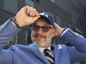 Toronto Police Association president Mike McCormack dons a TPA baseball cap demonstrating their protest on Thursday, Sept. 14, 2017. (STAN BEHAL/TORONTO SUN)