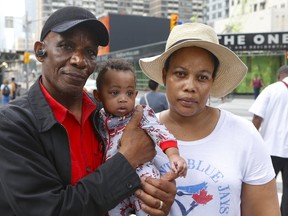 Beverley Graham Thompson, 38, fears she and her son Justin Thompson, born in Canada just four months ago, will be deported to her native Jamaica this week forcing her to be separated from her husband of one year Bertram Thompson, 70. In an effort to raise awareness of the family's situation, Black Lives Matter held a demonstration that shut the busy intersection of Yonge and Bloor St. during the morning rush-hour on Tuesday, Sept. 19, 2017. (CHRIS DOUCETTE/TORONTO SUN)