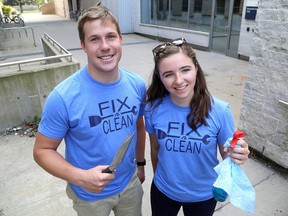 Liam Rodgers and Natalie Arpin, co-ordinators  of the Queen's University Engineering Society's Fix N Clean, outside of Munro-Beamish Hall.  (Ian MacAlpine/The Whig-Standard)