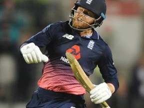 England’s Jonny Bairstow celebrates after reaching a century on Sept. 19, 2017, at Old Trafford in a One Day International match between England and West Indies.