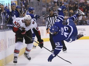 Toronto Maple Leafs centre Nazem Kadri is flipped up into the air after battling for the puck against Ottawa Senators defenceman Fredrik Claesson in Toronto on Sept. 19, 2017. (Veronica Henri/Toronto Sun/Postmedia Network)