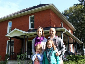 The Margot family, including parents Roxanne and Dan and their daughters Rita, 7, front left, and Olive, 9, are hoping they can remain in Canada living in their dream home near Muirkirk. Their application for a work permit has been refused by Immigration, Refugees and Citizenship Canada and their temporary resident status has expired, leaving their future in Canada in doubt.