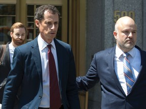 In a Friday, May 19, 2017 file photo, former U.S. Rep. Anthony Weiner leaves Federal court, in New York. Federal prosecutors says former Congressman Anthony Weiner should go to prison for about two years for engaging in sexting with a 15-year-old girl. Prosecutors filed papers in Manhattan federal court Wednesday, Sept. 20, 2017, urging a judge to send a message at sentencing Monday. (AP Photo/Mary Altaffer, File)