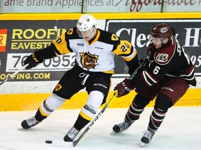 Peterborough Petes' Kyle Jenkins pressures Hamilton Bulldogs' Cole Candella during third period OHL action on Sunday January 1, 2017 at the Memorial Centre in Peterborough, Ont. The Petes lost 6-3 ending their 10-game consecutive wins. The Petes will host Kingston Tuesday ay 7:05 p.m. Clifford Skarstedt/Peterborough Examiner/Postmedia Network