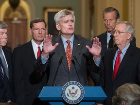 U.S. Sen. Bill Cassidy, R-La., centre, joined by, from left, Sen. Lindsey Graham, R-S.C., Sen. Roy Blunt, R-Mo., Sen. John Barrasso, R-Wyo., Sen. John Thune, R-S.D., and Senate Majority Leader Mitch McConnell, R-Ky., speaks to reporters as he pushes a last-ditch effort to uproot former U.S. President Barack Obama's health care law, at the Capitol in Washington, Tuesday, Sept. 19, 2017. (AP Photo/J. Scott Applewhite)