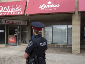 Police arrested five people in a raid on London?s newest marijuana dispensary, London Relief Centre. (DEREK RUTTAN, The London Free Press)