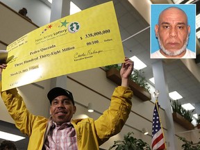Pedro Quezada holds up a Powerball promotional check during a news conference at the New Jersey Lottery headquarters in Lawrenceville, N.J., in this March 26, 2013 file photo. Quezeda, 49, has been charged with sexual assault and endangering the welfare of a child.  (AP Photo/Julio Cortez/Passaic County Prosecutor's Office/HO)