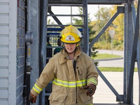 Whig-Standard journalist Steph Crosier takes on the challenge of the FireFit Challenge at the Kingston Fire and Rescue's training Centre in Kingston on Wednesday. (Julia McKay/The Whig-Standard)