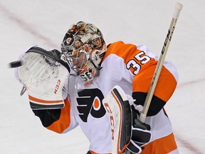 Philadelphia Flyers goalie Steve Mason makes a save against the New York Rangers during the first period in Game 7 of the first round of the 2014 Stanley Cup Playoffs at Madison Square Garden. (Adam Hunger/USA TODAY Sports)