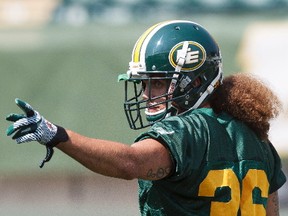 Cornerback Aaron Grymes (36) points during an Edmonton Eskimos practice at Commonwealth Stadium in Edmonton, Alta., on Tuesday, July 15, 2014. The Eskimos announced they had signed Grymes after he was cut by the Philadelphia Eagles of the NFL.