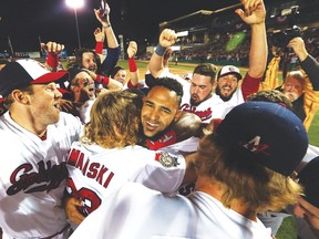 The Goldeyes celebrate after crushing the Wichita Wingnuts 18-2 in Game 5 to win their second straight title. (Kevin King/Winnipeg Sun)