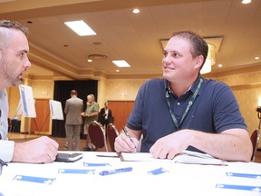 Project director David Shelsted, right, chats with Derek Young at the Kingsway Entertainment District and Arena/Event Centre brainstorming session at the Radisson Hotel in Sudbury, Ont. on Wednesday September 20, 2017. Gino Donato/Sudbury Star/Postmedia Network