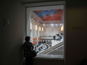 A woman follows a debate on the CETA (Comprehensive Economic and Trade Agreement) between EU and Canada during the first session of Austria's Parliamentat at the Hofburg palace in Vienna, Austria, on September 20, 2017.
For the first time, the Parliament session was held today at the Hofburg palace, as the Parliament building is closed due to renovation. / AFP PHOTO / JOE KLAMARJOE KLAMAR/AFP/Getty Images