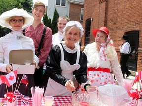 Lemonade along with British and Canadian delicacies were served up during the Pickwick Picnic in Chatham on Canada Day, an event organized by the Chatham-Kent Dickens Fellowship. From left are Kate Rosser-Davies, Mike DeBoer, Jessica Jeschke, Patti Pook and Sue Marshall.