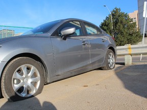 Seventeen tires were slashed on vehicles parked in the Free Press parking lot at 369 York St. late Wednesday night. Police have charged a man with six counts of mischief under $5,000. (DALE CARRUTHERS, The London Free Press)