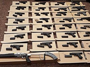 Durham Regional Police seized 33 guns and other prohibited devices, such as overcapacity magazines, from a Pickering residence Wednesday and laid 337 charges against the homeowner. (HANDOUT/DURHAM REGIONAL POLICE)