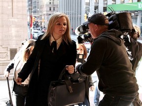 Laura Miller, deputy chief of staff to former Ontario premier Dalton McGuinty, arrives at court in Toronto on Monday, Sept. 11, 2017. Miller and her superior, David Livingston, face allegations they illegally destroyed documents related to a government decision to scrap two gas plants ahead of the 2011 provincial election. (THE CANADIAN PRESS/PHOTO)