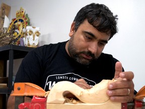 Yousef Alkurdi works on a project at the new London Community Woodshop. A recent immigrant from Syria, Alkurdi is also an accomplished wood carver who said he is starting over in London following three years in a Lebanese hospital recovering from an injury he sustained when an missile exploded near his home. (CHRIS MONTANINI\LONDONER\POSTMEDIA NETWORK)