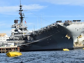 Speed boaters get a thrill riding beneath the bow of the giant aircraft carrier USS Midway. It?s the length of three football fields and served from 1945 to 1992. It is now a museum, docked in San Diego Bay. (BARBARA TAYLOR, The London Free Press)