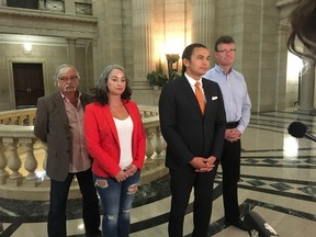 NDP leader Wab Kinew (centre) unveils caucus critics at the Manitoba Legislature in Winnipeg on Thursday, Sept. 21, 2017, along with NDP MLAs Tom Lindsey (leftl) Nahanni Fontaine and Andrew Swan (right). TOM BRODBECK/Winnipeg Sun/Postmedia Network