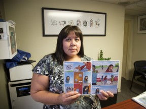 Lisa Jackson displays a comic book produced by the Association of Iroquois and Allied Indians, which will be launched at the Forest City Comicon. (DEREK RUTTAN, The London Free Press)
