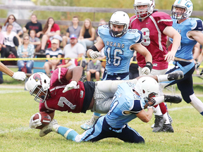 Cody Boyle of the St. Benedict Bears hauls down Bankamina N'Galamulume of the St. Charles Cardinals during senior boys high school football action in Sudbury, Ont. on Thursday September 21, 2017. Gino Donato/Sudbury Star/Postmedia Network
Gino Donato, Gino Donato/Sudbury Star