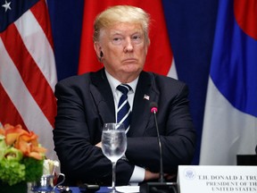 President Donald Trump listens during a luncheon with South Korean President Moon Jae-in and Japanese Prime Minister Shinzo Abe, at the Palace Hotel during the United Nations General Assembly, Thursday, Sept. 21, 2017, in New York. (AP Photo/Evan Vucci)