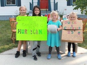 A group of elementary school-aged Good Samaritans were selling lemonade and cookies on the corner of Devine and Savoy streets to raise money for victims of Hurricane Irma. Over three days, the girls raised $210. From left to right are: Chaeli, 7, Honour, 8, Nevaeh, 4 and Audrey, 6. (Carl Hnatyshyn/Postmedia Network)