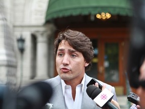 Liberal Leader Justin Trudeau answers questions from the media in Quebec City, August 22, 2013. (THE CANADIAN PRESS/ Francis Vachon)