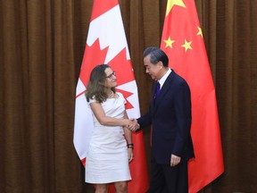Wu Hong/The Associated Press
Canadian Foreign Minister Chrystia Freeland, left, is greeted by Chinese Foreign Minister Wang Yi as she arrives for a meeting at the Ministry of Foreign Affairs in Beijing on Aug. 9.