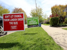 Community engagement, like the public input in the city?s bus rapid transit plan that resulted in these lawn signs, are healthy, says columnist Glen Pearson. (Free Press file photo)