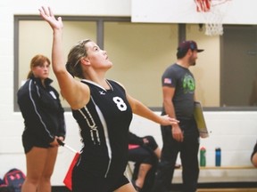 Hawk Emily Slocombe serves the volleyball during a game against Nanton’s J.T. Foster Friday.