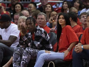 Houston rapper Travis Scott and Kylie Jenner watch courtside during Game Five of the Western Conference Quarterfinals game of the 2017 NBA Playoffs at Toyota Center on April 25, 2017 in Houston, Texas. According to reports, TV personality/entrepreneur Jenner is expecting her first child with rapper Scott. (Photo by Bob Levey/Getty Images)