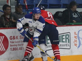 Blake Murray, left, of the Sudbury Wolves, is pinned on the boards by Serron Noel, of the Oshawa Generals, during OHL action at the Sudbury Community Arena in Sudbury, Ont. on Friday September 22, 2017. John Lappa/Sudbury Star/Postmedia Network
John Lappa, John Lappa/Sudbury Star