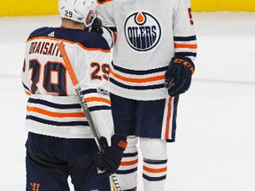 dmonton's Kailer Yamamoto (56) celebrates a goal with Leon Draisaitl (29) during the third period of a preseason NHL game between the Edmonton Oilers and the Vancouver Canucks at Rogers Place in Edmonton, Alberta on Friday, September 22, 2017.