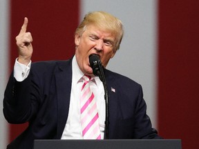 U.S. President Donald Trump weighed in on NFL players kneeling during the national anthem during a campaign rally in support of Sen. Luther Strange in Huntsville, Ala., on Friday, Sept. 22, 2017. (Brynn Anderson/AP Photo)