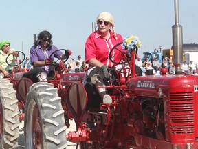 The Team Farmall Dancing Tractors showcased their tractor dancing skills while having some fun dressed up like women. (Shaun Gregory/Huron Expositor)