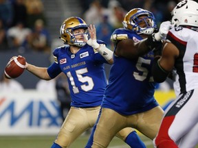 Winnipeg Blue Bombers quarterback Matt Nichols (15) throws against the Ottawa Redblacks during the first half of CFL action in Winnipeg Friday, September 22, 2017. THE CANADIAN PRESS/John Woods